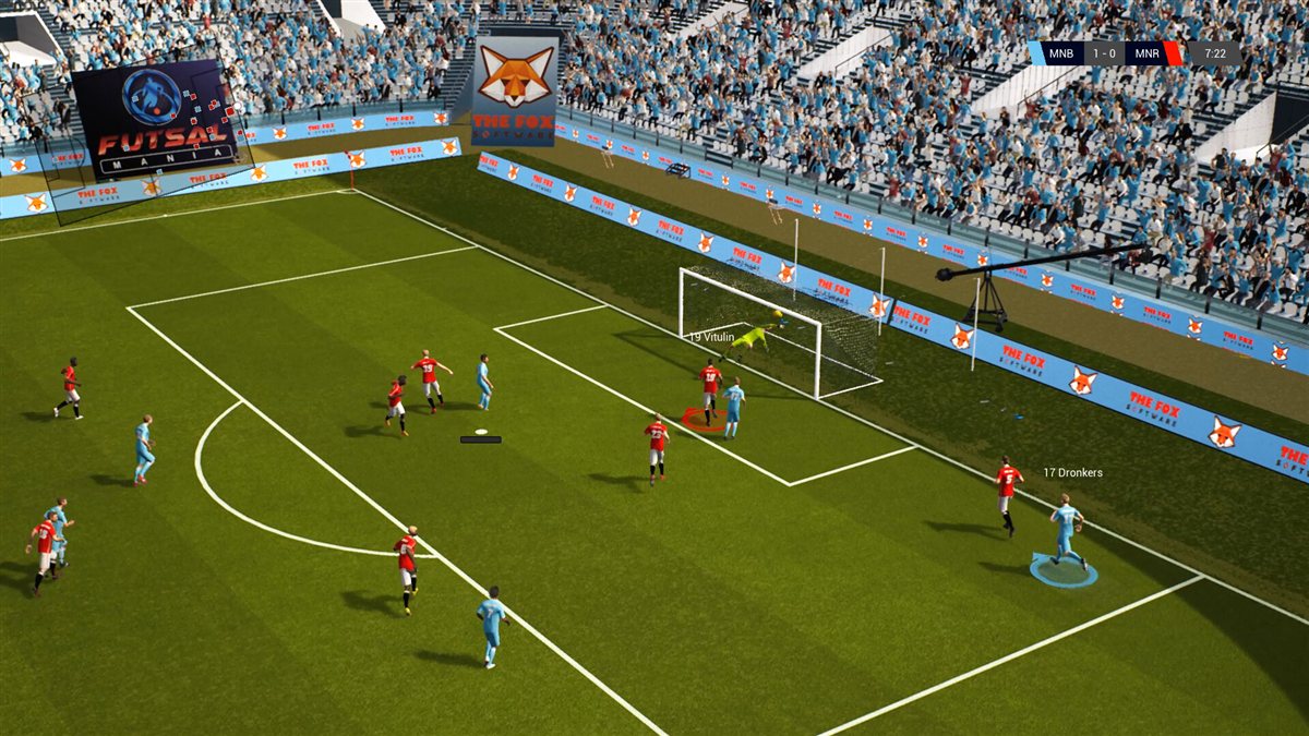 Active Soccer 3 screenshot: top-down arcade football match in a packed stadium, attacking players closing in on the goal.