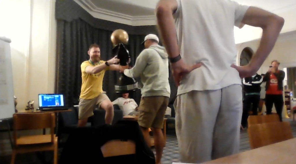 Playaveli receives the PC SWOS World Cup trophy on Sunday night in Cambridge, reaching out as the golden trophy is presented to him.