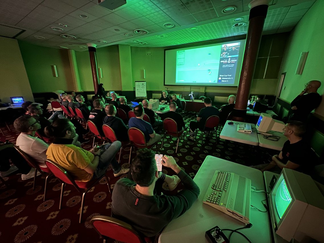 Kick Off 2 World Cup 2025 in Milan: Silver Cup final on the big screen, with spectators watching from the tournament room.